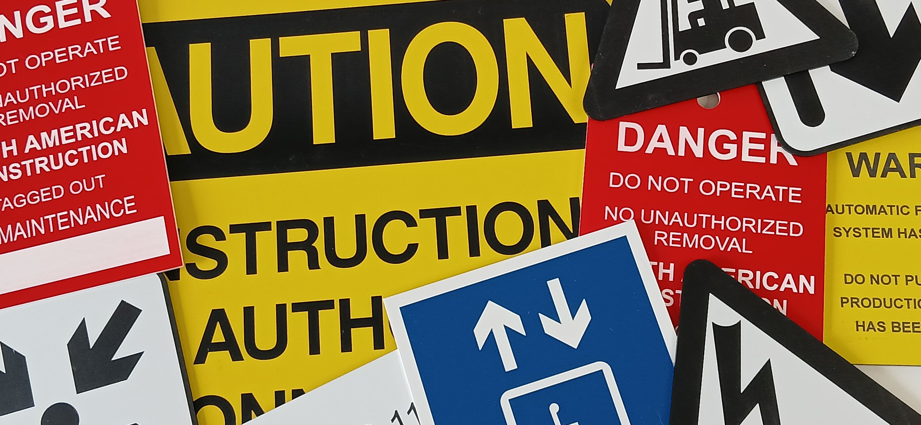 Custom engraved industrial warning and instruction signs made from 2-ply plastic or lamacoid
