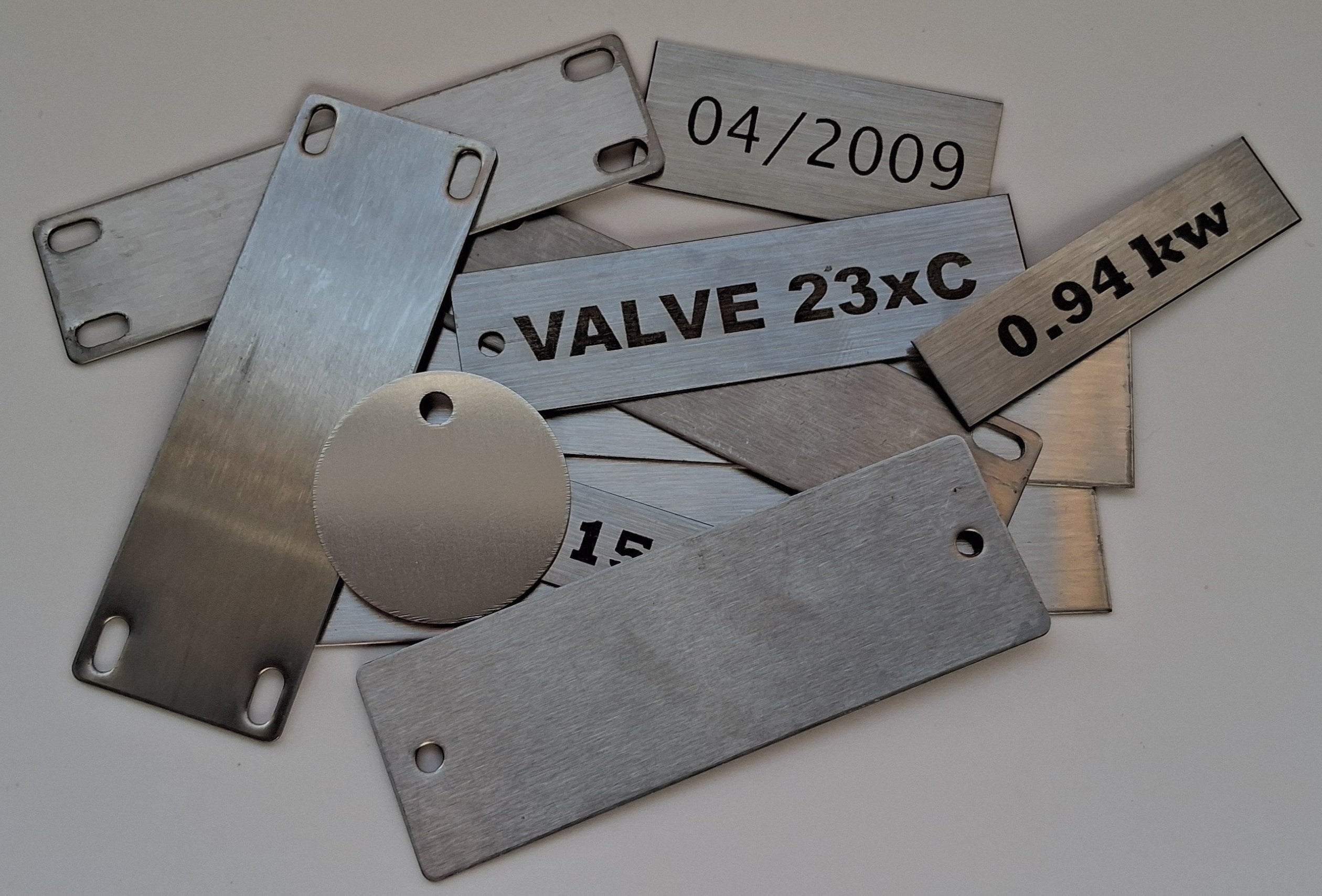 Custom engraved stainless steel cable tags, valve tags, control tags, date tags
