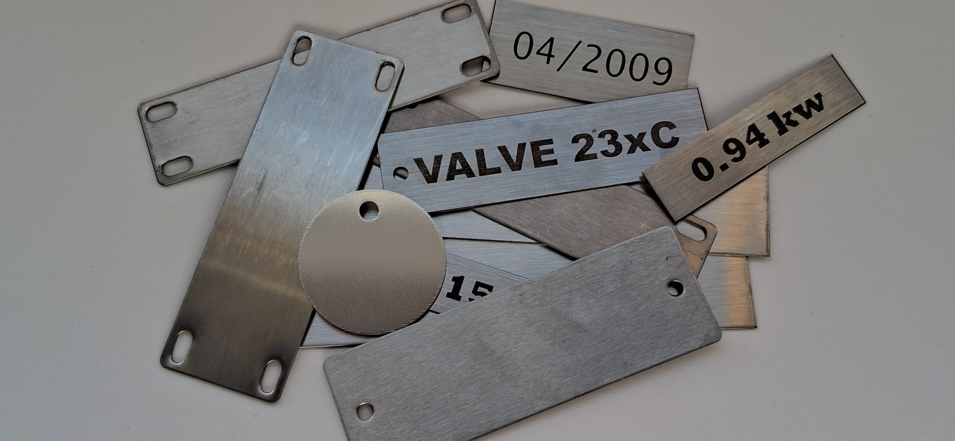 Custom engraved stainless steel cable tags, valve tags, control tags, date tags