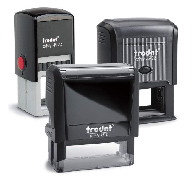 Three self-inking Trodat stamps on a white background